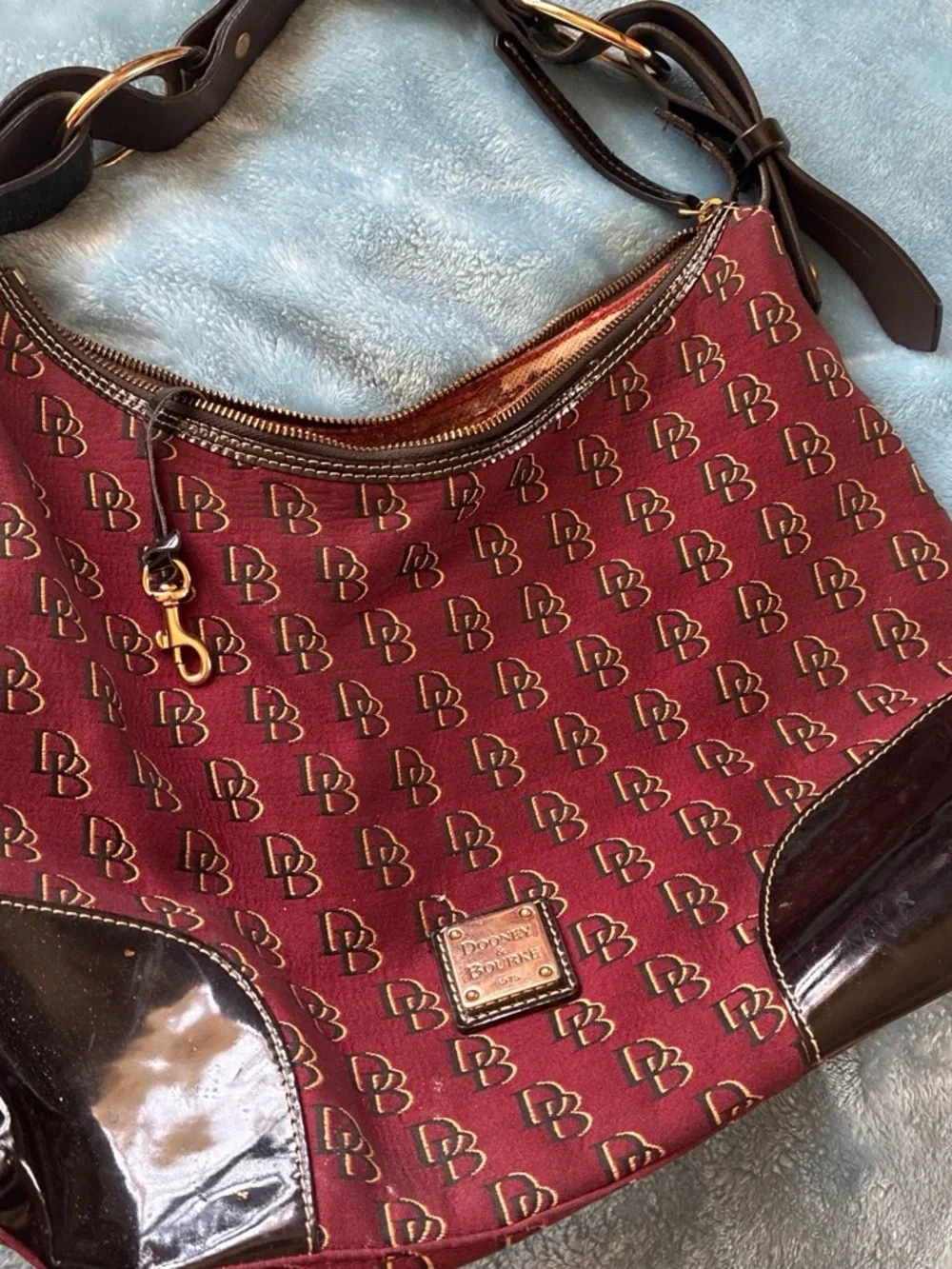 Dooney & Bourke Burgundy DB Monogram Hobo with Dark Brown Trim. Needs some TLC